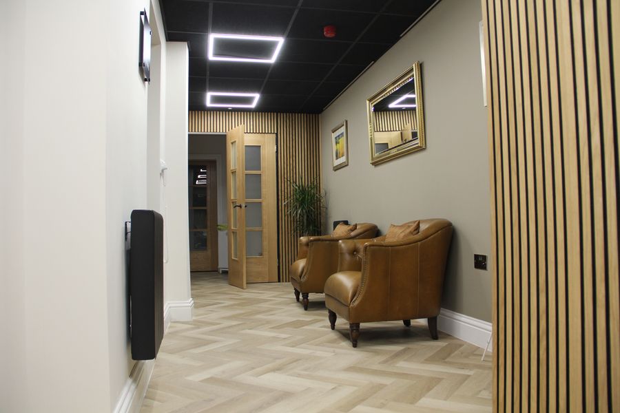 Two leather chairs i a reception area